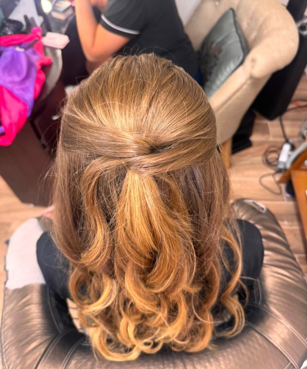 Golden half-up hairstyle with loose curls