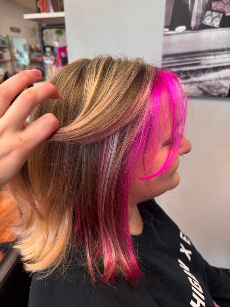 Pink accent color shown through blonde layers