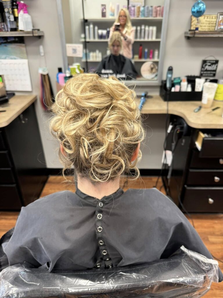 Detailed blonde updo at the styling station