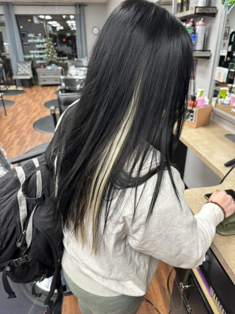 Long glossy black hair at a styling station